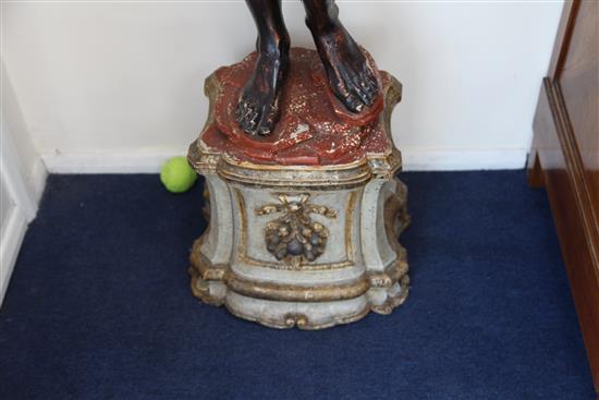 A pair of Venetian carved, painted and parcel gilt blackamoor torcheres, H.6ft 6in.